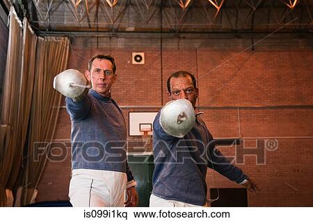 Senior and mature men holding fencing foils View Large Photo Image Stock Photography - Senior and mature men holding fencing foils. Fotosearch