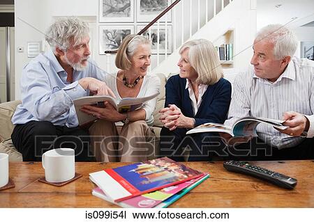 Senior friends planning holiday View Large Photo Image Stock Image - Senior friends planning holiday. Fotosearch
