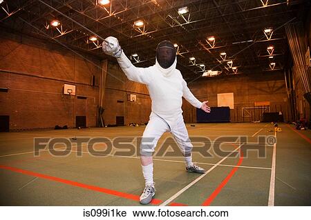 Senior man in fencing suit holding foil View Large Photo Image Stock Image - Senior man in fencing suit holding foil. Fotosearch