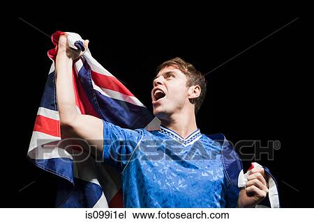 Soccer player holding Union flag View Large Photo Image Stock Image - Soccer player holding Union flag. Fotosearch