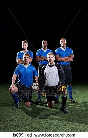 Soccer team on pitch at night View Large Photo Image Stock Image - Soccer team on pitch at night. Fotosearch