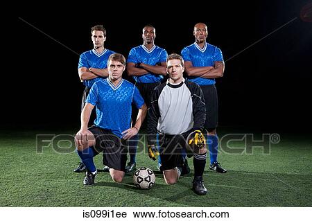 Soccer team on pitch at night View Large Photo Image Stock Image - Soccer team on pitch at night. Fotosearch