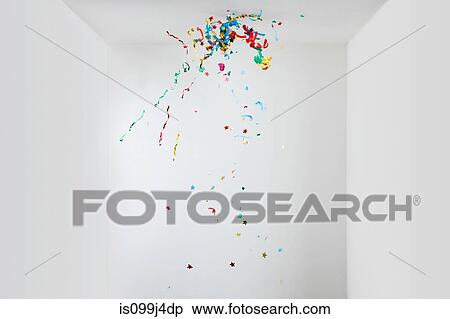 Stock Photography - Streamers and confetti in mid air. Fotosearch