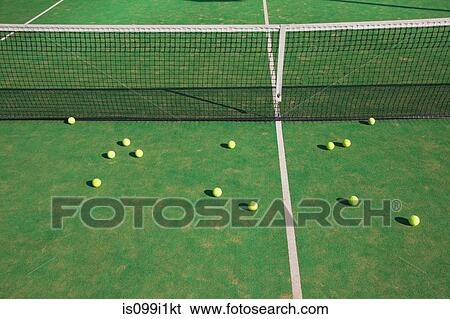 Tennis balls on court View Large Photo Image Stock Photograph - Tennis balls on court. Fotosearch