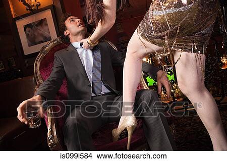 Woman grabbing businessman in bar View Large Photo Image Picture - Woman grabbing businessman in bar. Fotosearch