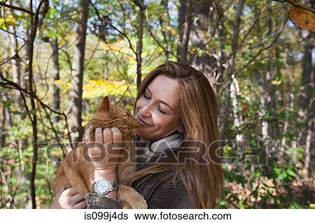 Woman stroking pet cat View Large Photo Image Stock Photograph - Woman stroking pet cat. Fotosearch