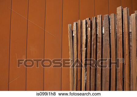 Wooden fencing against wall View Large Photo Image Stock Photo - Wooden fencing against wall. Fotosearch