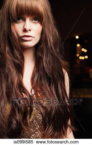 Young woman with long red hair View Large Photo Image Stock Photography - Young woman with long red hair. Fotosearch