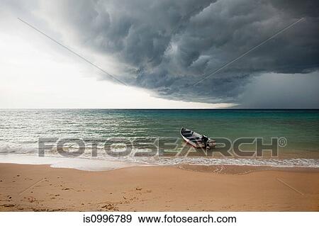 Boat on sea under stormy sky, Perhentian Kecil, Malaysia View Large Photo Image Stock Photo - Boat on sea under stormy sky, Perhentian Kecil, Malaysia. Fotosearch