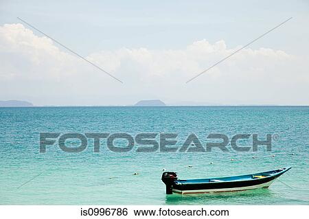 Boat on the ocean, Perhentian Islands, Malaysia View Large Photo Image Stock Photograph - Boat on the ocean, Perhentian Islands, Malaysia. Fotosearch