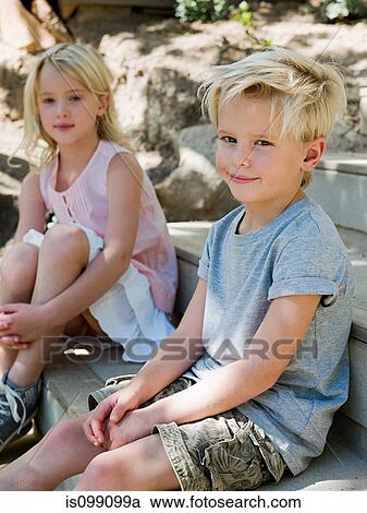 Brother and sister sitting on wooden steps, portrait View Large Photo Image Stock Image - Brother and sister sitting on wooden steps, portrait. Fotosearch
