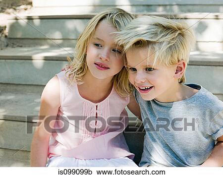 Brother and sister sitting on wooden steps View Large Photo Image Stock Image - Brother and sister sitting on wooden steps. Fotosearch