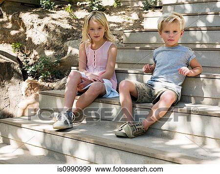 Brother and sister sitting on wooden steps, portrait View Large Photo Image Stock Photo - Brother and sister sitting on wooden steps, portrait. Fotosearch
