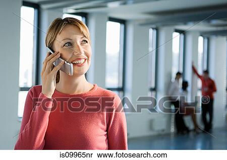 Businesswoman on cell phone View Large Photo Image Stock Photography - Businesswoman on cell phone. Fotosearch