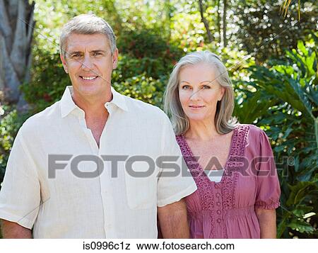 Couple in garden, portrait View Large Photo Image Stock Photo - Couple in garden, portrait. Fotosearch