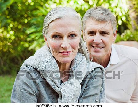 Couple in garden, portrait View Large Photo Image Stock Photograph - Couple in garden, portrait. Fotosearch