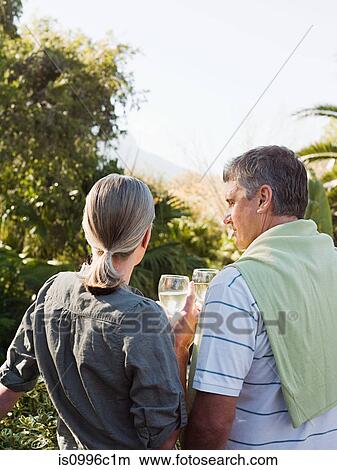 Picture - Couple looking at view from garden. Fotosearch