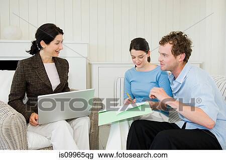Couple meeting financial advisor at home View Large Photo Image Stock Image - Couple meeting financial advisor at home. Fotosearch