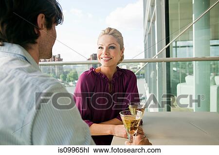 Couple on balcony with wine View Large Photo Image Stock Image - Couple on balcony with wine. Fotosearch