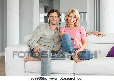 Couple on sofa, portrait View Large Photo Image Stock Image - Couple on sofa, portrait. Fotosearch