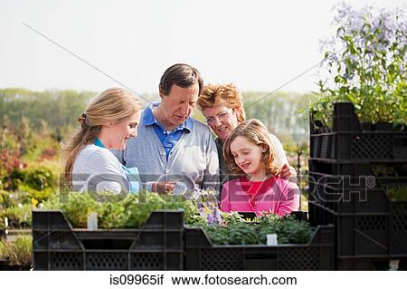 Stock Image - Family at garden center. Fotosearch
