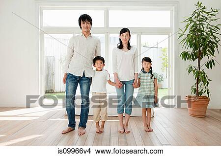 Picture - Family with two children at home, portrait. Fotosearch