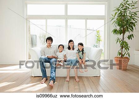 Family with two children on sofa, portrait View Large Photo Image Stock Photo - Family with two children on sofa, portrait. Fotosearch