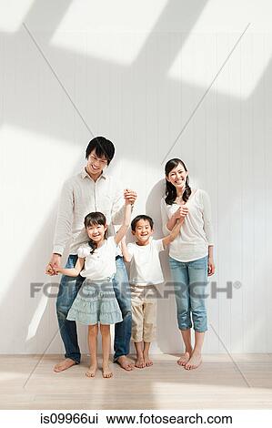 Stock Image - Family with two children, portrait. Fotosearch