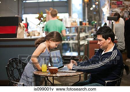 Father and daughter with laptop in cafe View Large Photo Image Stock Photo - Father and daughter with laptop in cafe. Fotosearch