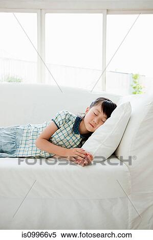 Girl asleep on sifa View Large Photo Image Stock Photography - Girl asleep on sifa. Fotosearch