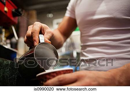 Man making coffee in cafe, close up View Large Photo Image Stock Image - Man making coffee in cafe, close up. Fotosearch