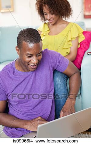 Picture - Man using laptop. Fotosearch