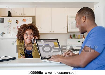 Stock Image - Man using laptop. Fotosearch