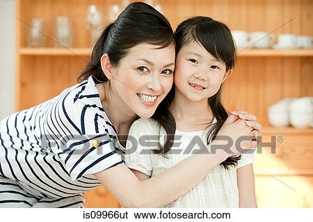 Stock Photograph - Mother and daughter, portrait. Fotosearch