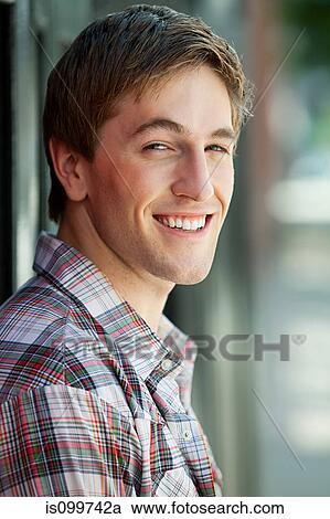 Portrait of young man smiling View Large Photo Image Stock Image - Portrait of young man smiling. Fotosearch
