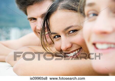 Three people, close up portrait View Large Photo Image Stock Photo - Three people, close up portrait. Fotosearch