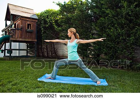 Woman doing yoga in garden View Large Photo Image Stock Image - Woman doing yoga in garden. Fotosearch