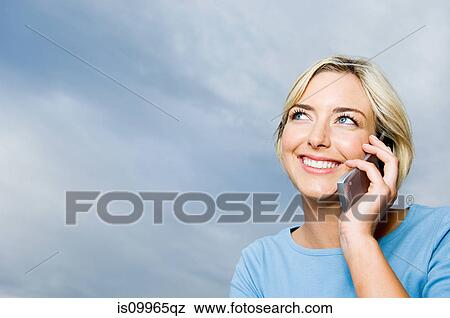 Woman using cell phone View Large Photo Image Stock Photo - Woman using cell phone. Fotosearch