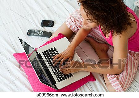 Woman using laptop View Large Photo Image Picture - Woman using laptop. Fotosearch