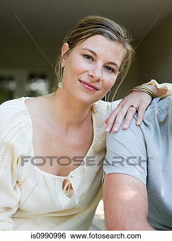 Woman with hand on man's shoulder, portrait View Large Photo Image Stock Photograph - Woman with hand on man's shoulder, portrait. Fotosearch