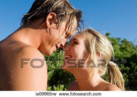 Young couple face to face View Large Photo Image Stock Photo - Young couple face to face. Fotosearch