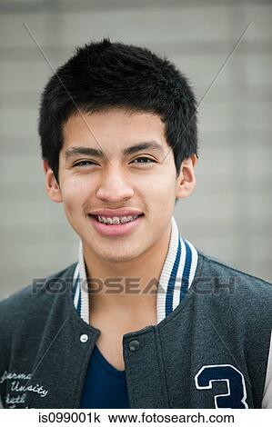 Young man wearing baseball jacket, portrait View Large Photo Image Stock Image - Young man wearing baseball jacket, portrait. Fotosearch