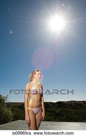 Young woman in pink bikini View Large Photo Image Stock Image - Young woman in pink bikini. Fotosearch