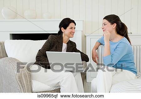 Young woman meeting financial advisor at home View Large Photo Image Stock Image - Young woman meeting financial advisor at home. Fotosearch