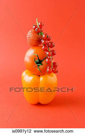 Arrangement of pepper, tomato, strawberry and red currants against orange background View Large Photo Image Stock Image - Arrangement of pepper, tomato, strawberry and red currants against orange background. Fotosearch