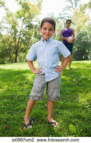Boy smiling in park View Large Photo Image Stock Image - Boy smiling in park. Fotosearch