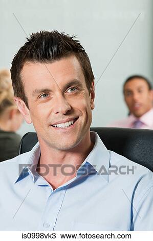 Stock Image - Business man smiling. Fotosearch
