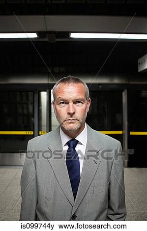 Businessman in subway station View Large Photo Image Stock Photo - Businessman in subway station. Fotosearch