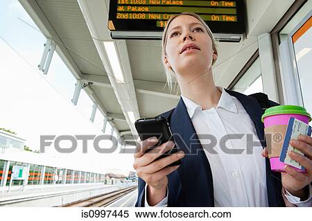 Businesswoman in train station View Large Photo Image Stock Photography - Businesswoman in train station. Fotosearch