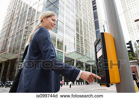 Businesswoman using pedestrian crossing View Large Photo Image Stock Image - Businesswoman using pedestrian crossing. Fotosearch